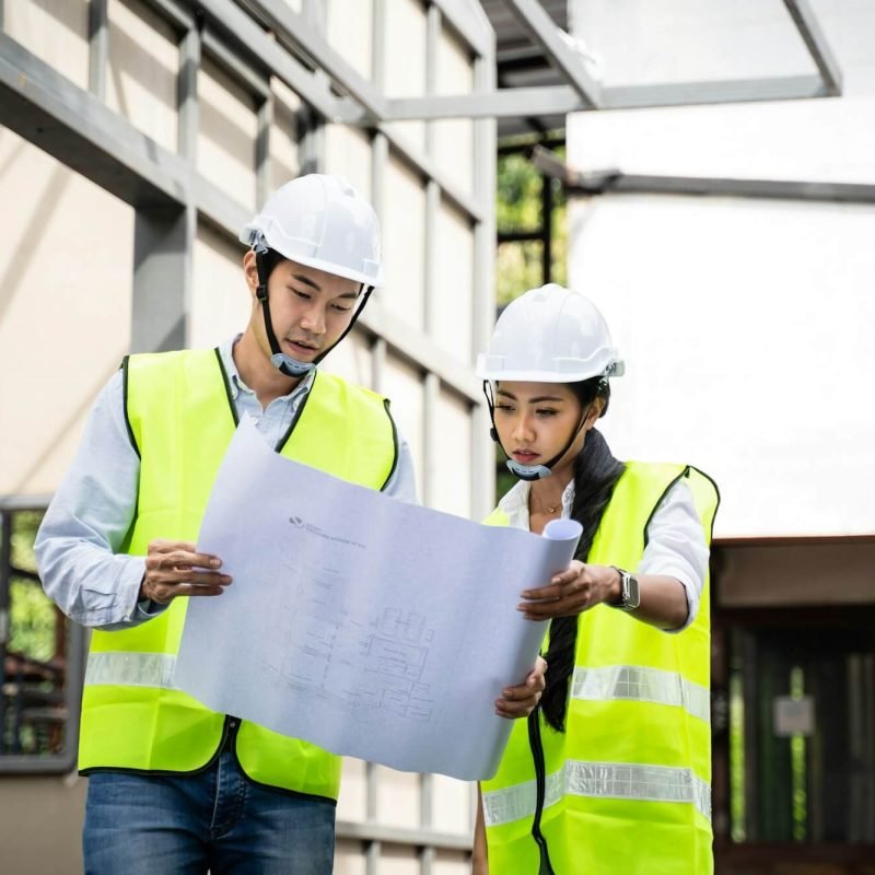 asian-colleague-workers-people-wearing-protective-safety-helmet-and-glasses-onsite-of-architecture-.jpg